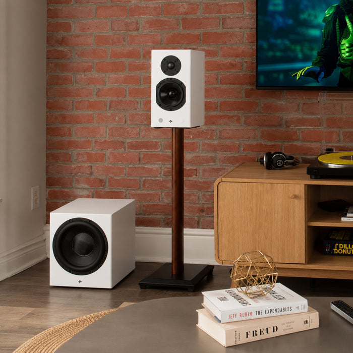 White Totem Acoustic KIN Sub 10 Wireless Subwoofer in a listening room with Totem KIN bookshelf speakers