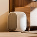 Bluesound PULSE SUB Wireless Subwoofer lifestyle shot, in white