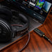Clarus CODA USB DAC lifestyle photo, with PC and Sennheiser headphones
