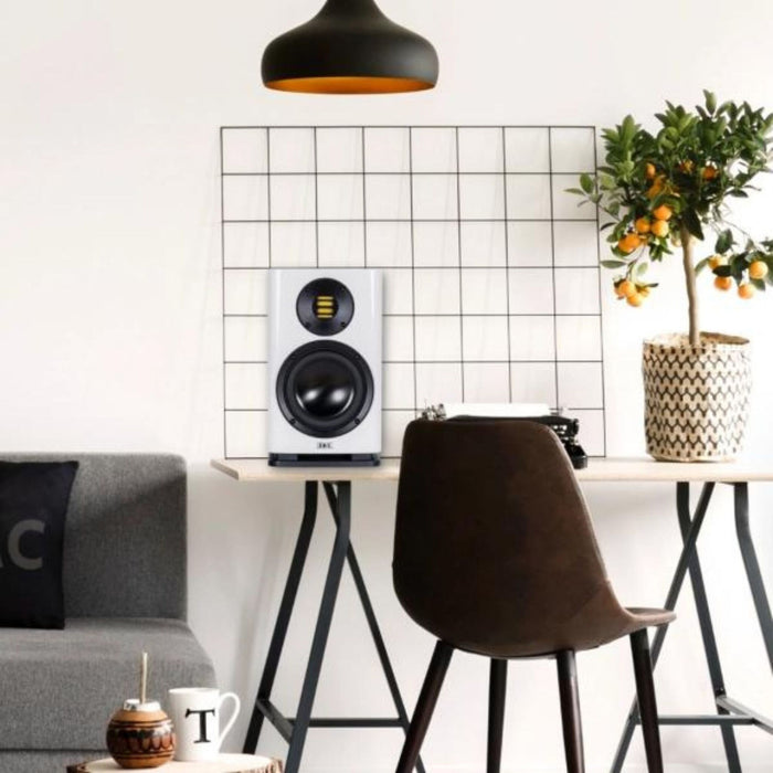 ELAC Solano 2.0 BS283 Bookshelf Speakers, gloss white, lifestyle shot matching living room aesthetic
