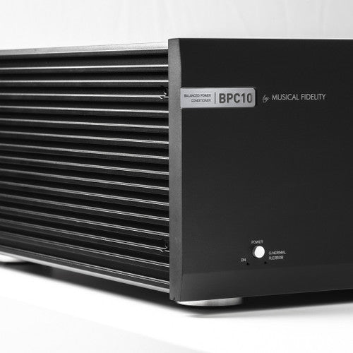 Close-up of Musical Fidelity BPC10 power button, logo, and side heat-dissipation fins