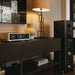 NAD M33 V2 BluOS Streaming Integrated Amplifier lifestyle photo in listening room
