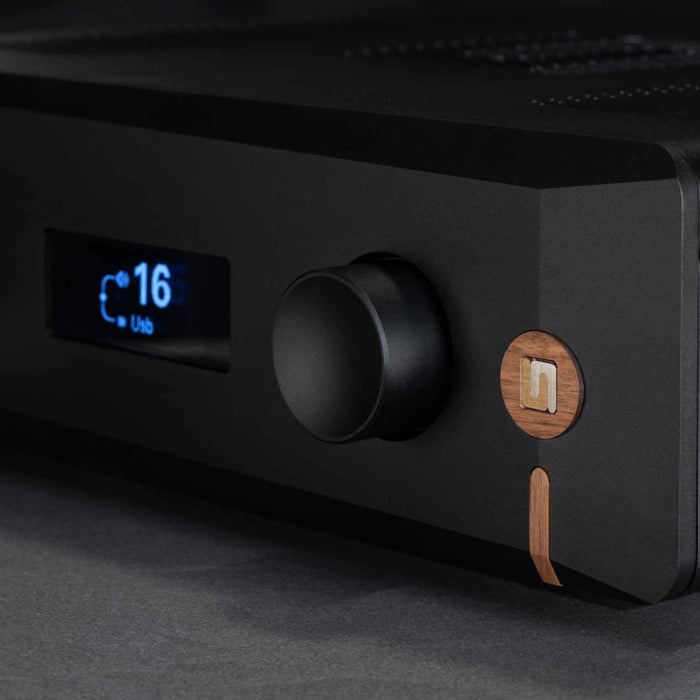 Unison Research Unico Pre v2, Midnight Black front detail view showing premium Unison Research wooden badging