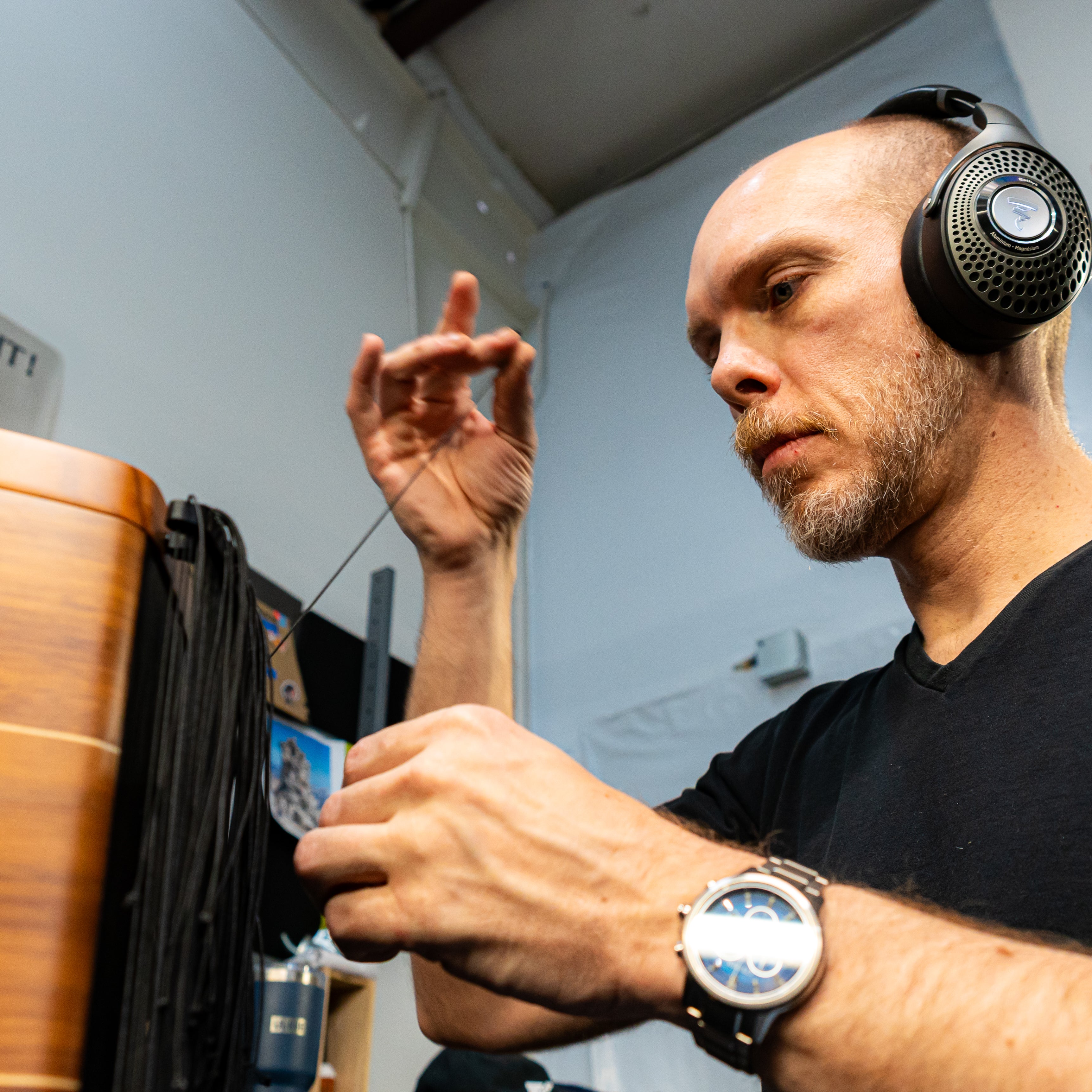 Staff working on a speaker