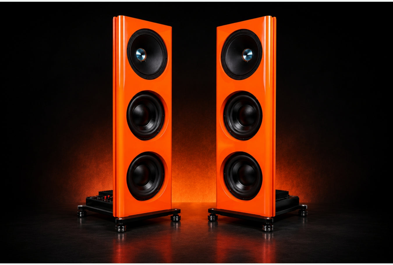 Pair of Lamborghini Orange Spatial Audio L2 Lumina Floorstanding Speakers in dark background